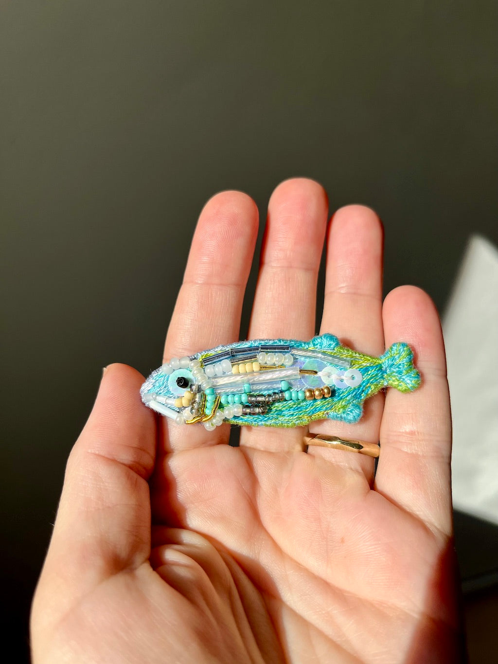 Hand-embroidered fish brooch in blue & green color, with glass beads and sequins, handmade in Vienna
