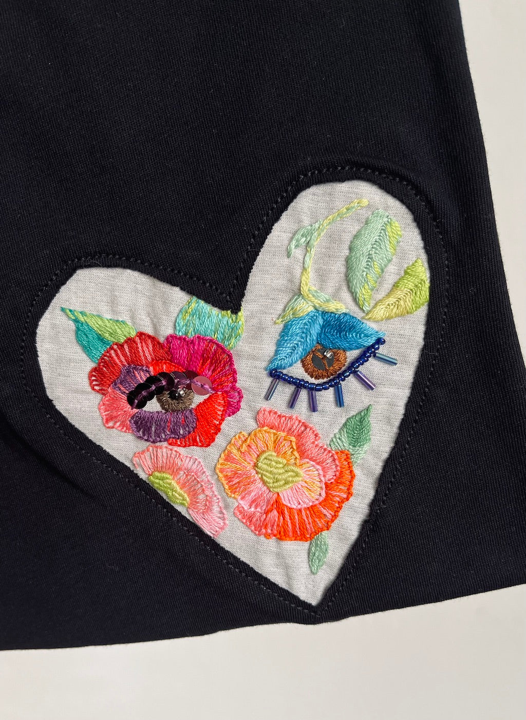 Hand-Embroidered T-Shirt — Garden Heart Flower Eyes (Black, L)