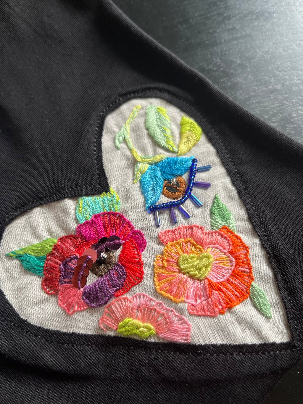 Hand-Embroidered T-Shirt — Garden Heart Flower Eyes (Black, L)