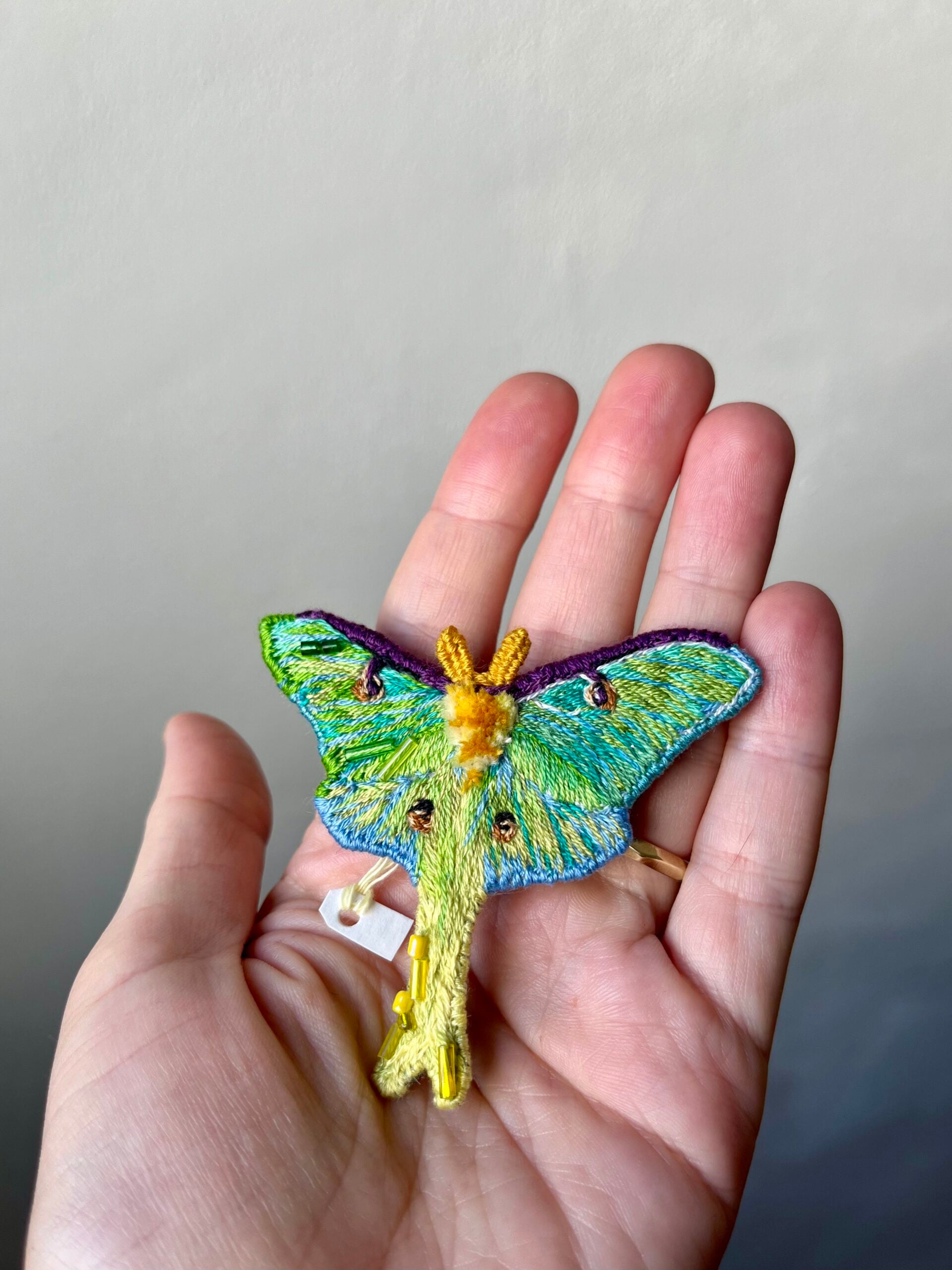 Hand-embroidered green luna moth brooch, handmade in Vienna, Austria