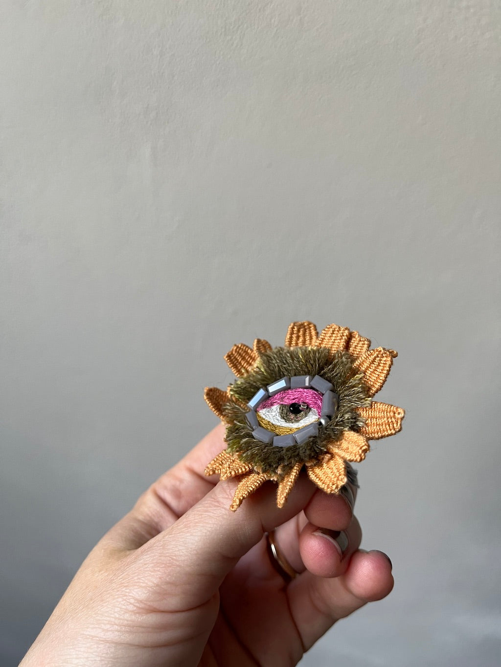 Handmade Embroidered Brooch – Flower Eye in Orange with Grey Beads