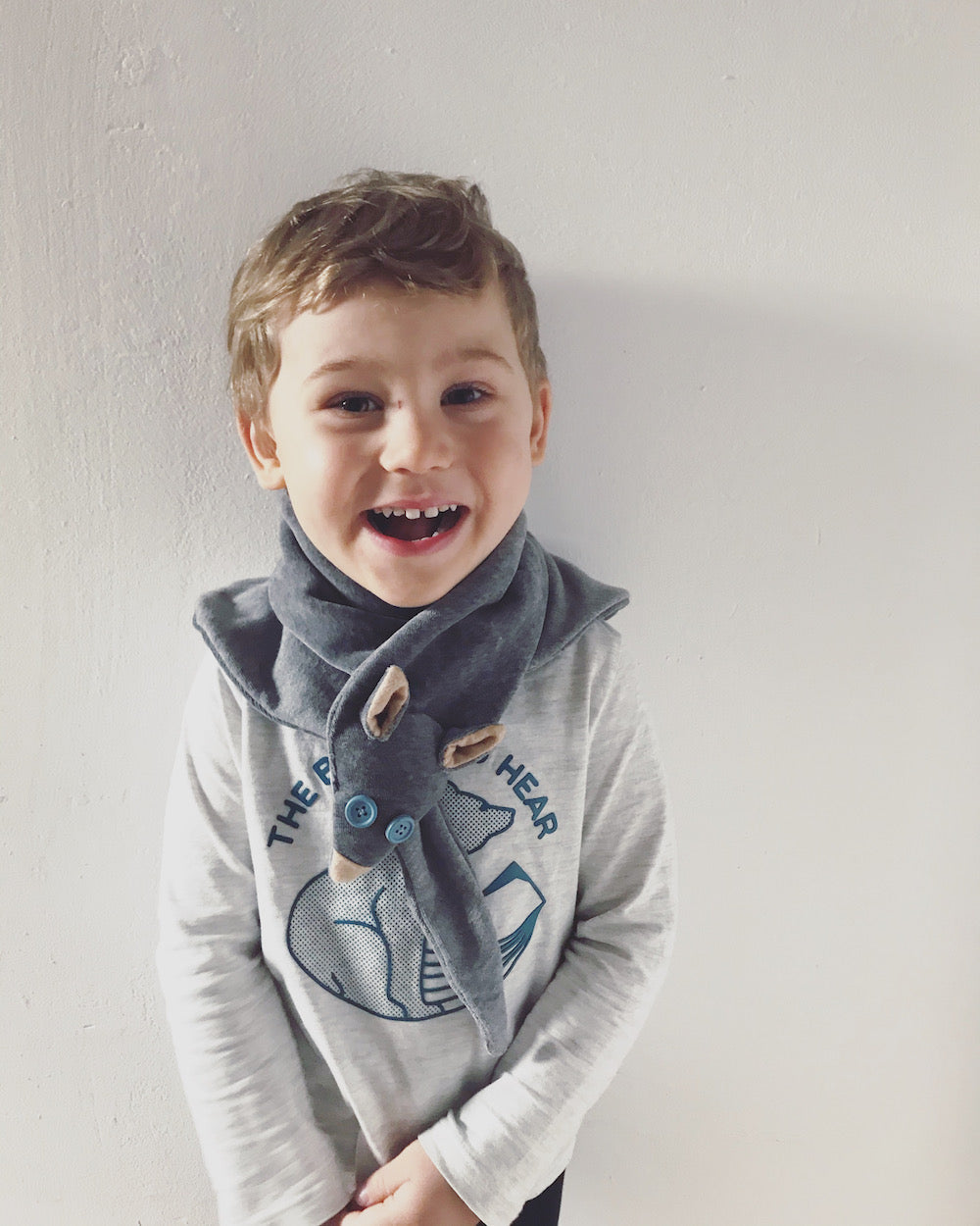 Grey organic cotton fox scarf for kids with light blue button eyes, super soft material.