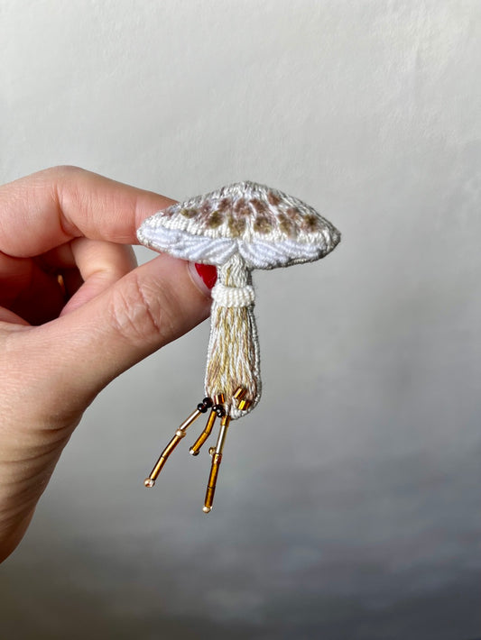 Hand-embroidered parasol mushroom brooch with glass beads, handmade in Vienna
