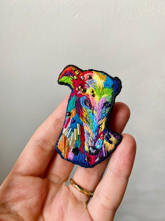 Hand-embroidered rainbow greyhound brooch with glass beads, handmade in Vienna