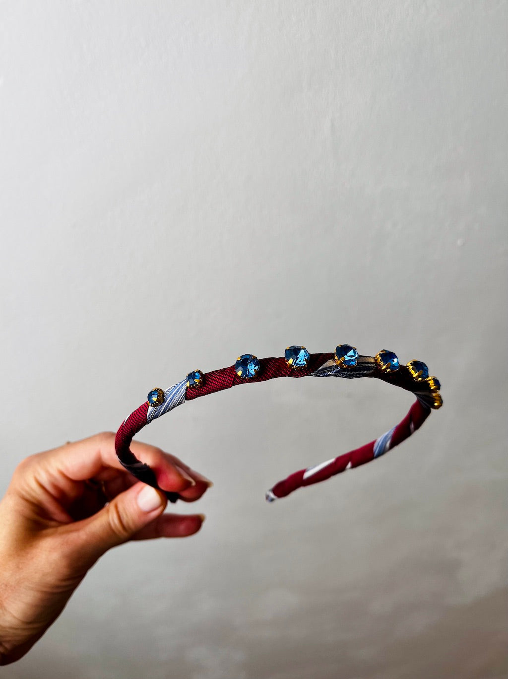 Silk Tie Headband in Burgundy – front view with blue glass crystals