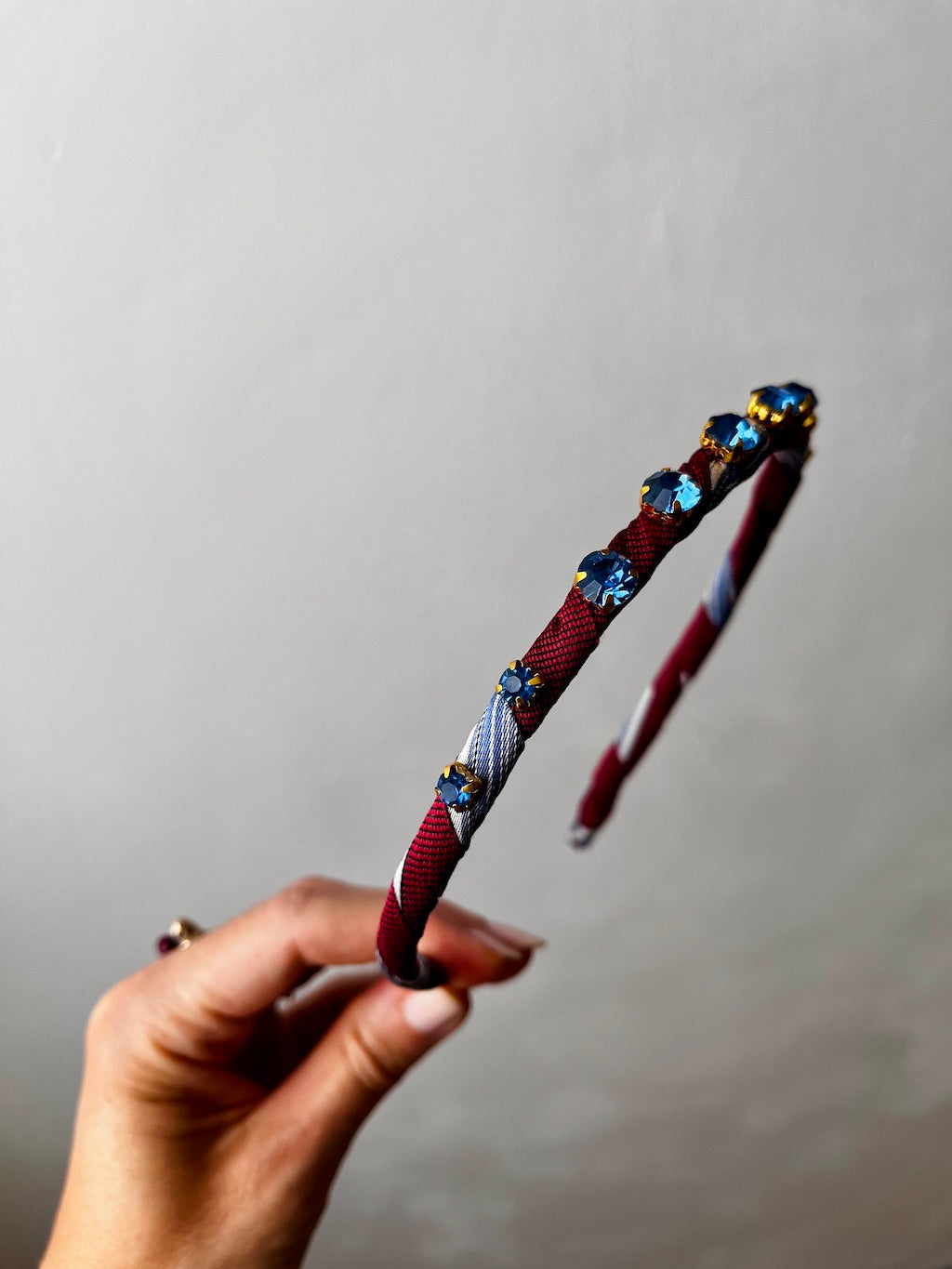 Silk Tie Headband in Burgundy – side view showing crystal detail
