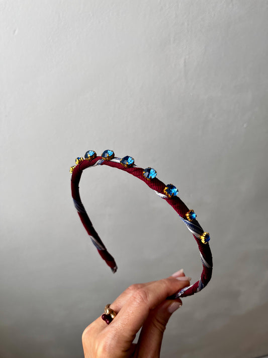 Handmade burgundy fabric headband with blue crystal gems in gold settings